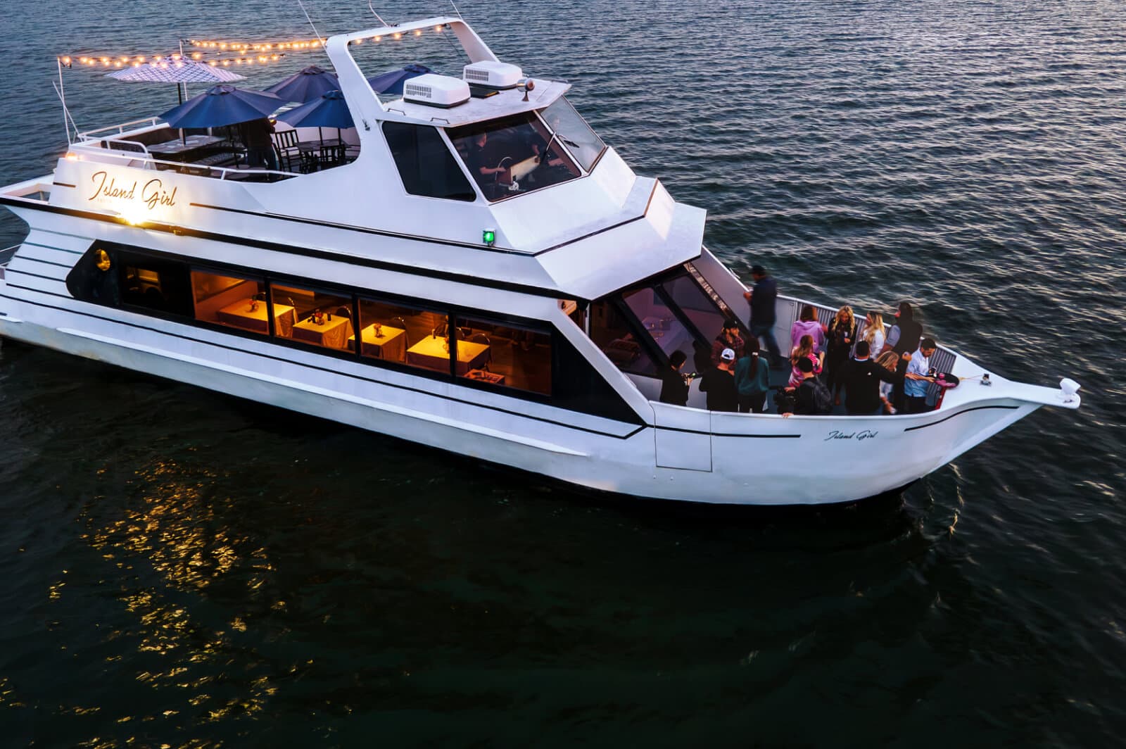 Guests enjoying an evening aboard Fastrac’s Island Girl