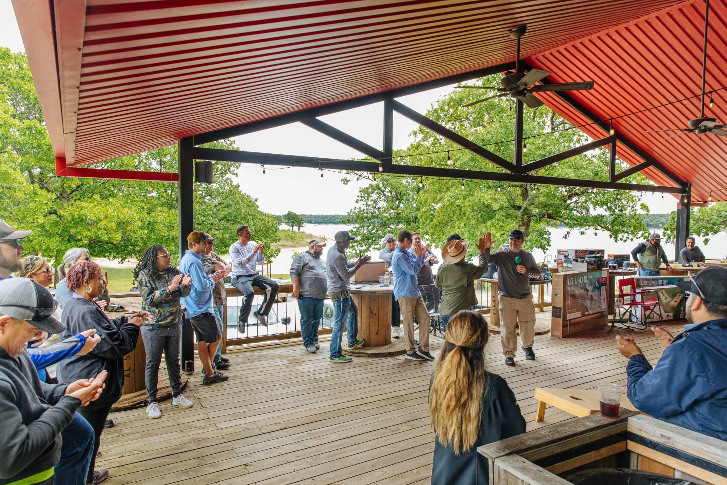 A group gathering on the covered deck at the Lighthouse Lodge