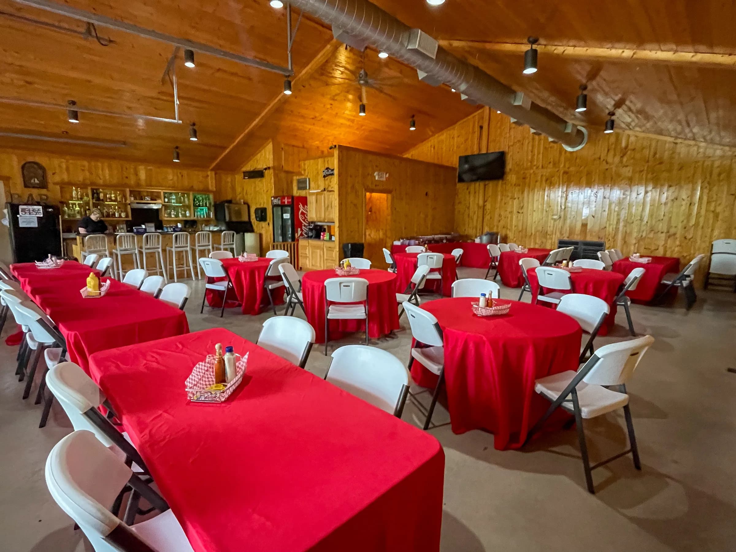 The wood-lined Lodge interior arranged with tables and chairs